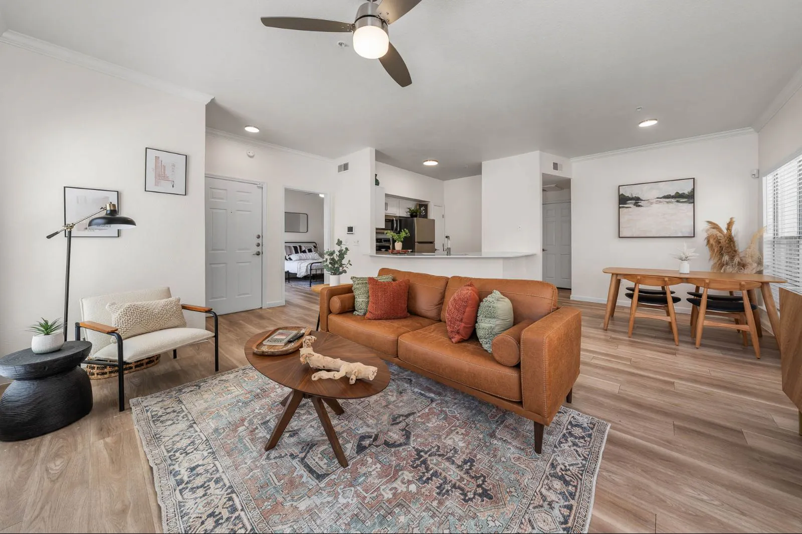Furnished apartment living area shown — representative home at Arboretum at South Mountain.