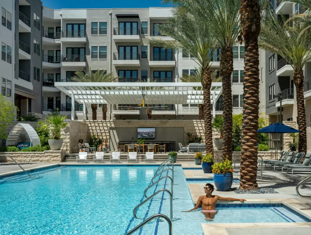 Palm-Lined Pool with Modern Seating  at Auric Symphony Park
