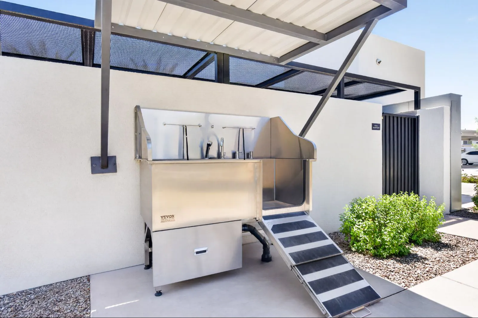 Outdoor pet wash station with ramp at Harmony at Hawes Crossing