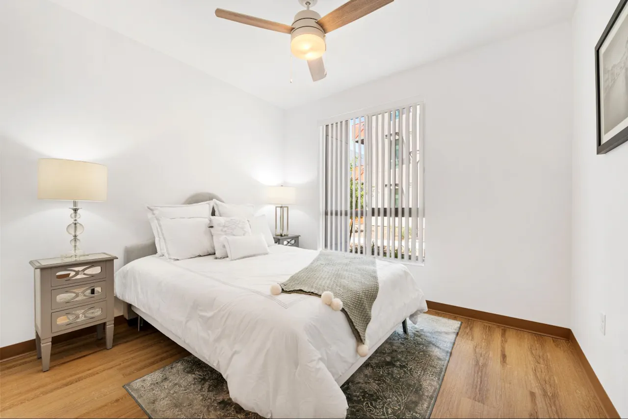 Furnished bedroom shown at Residences at Falcon Park.