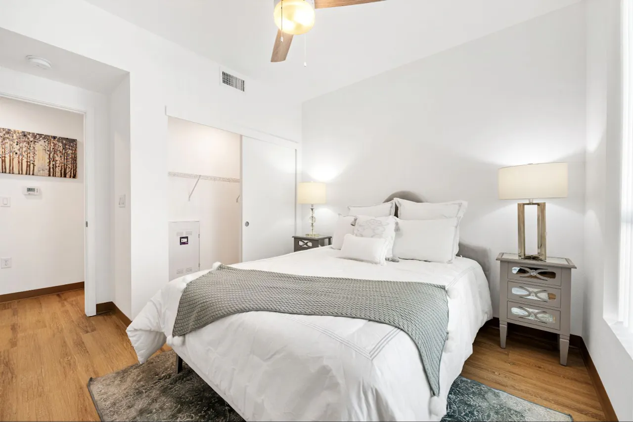 Furnished bedroom shown at Residences at Falcon Park.