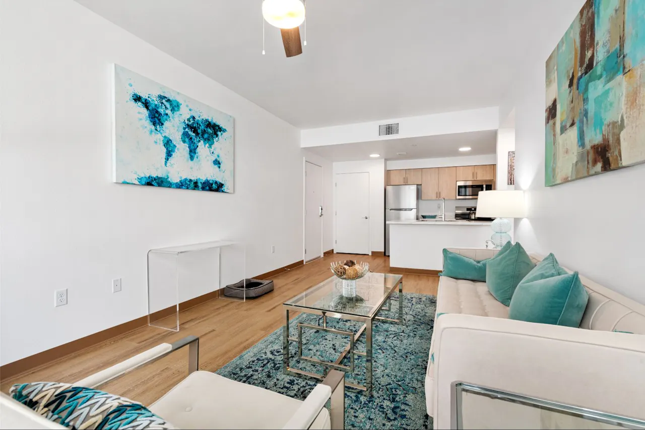 Furnished apartment living area shown at Residences at Falcon Park.