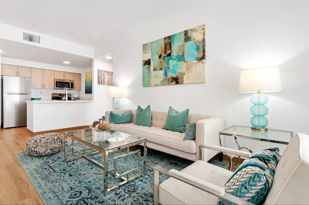 Furnished apartment living area shown at Residences at Falcon Park.