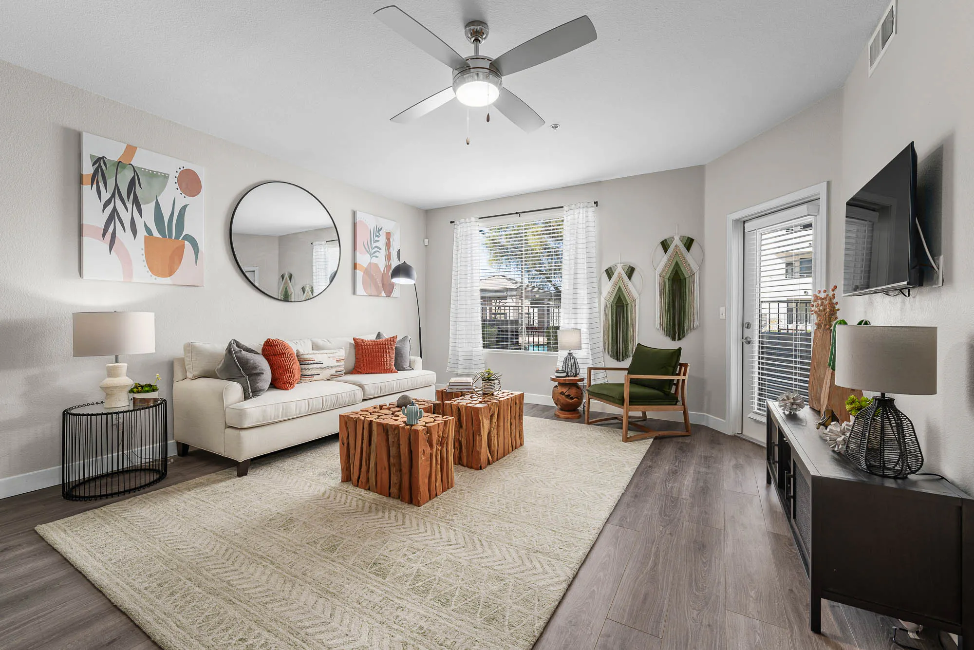 Furnished apartment living area shown — representative home at Spectra on 7th South.