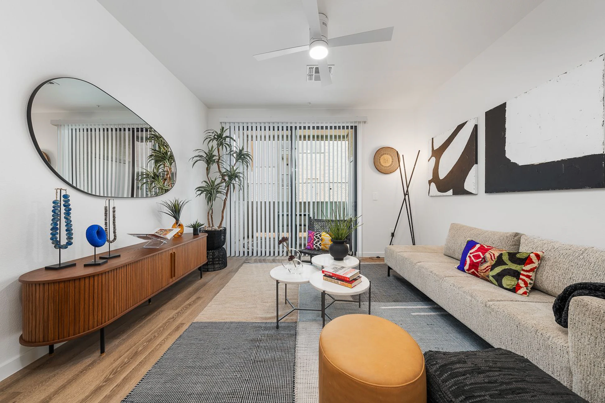 Furnished apartment living area shown — representative home at The Charleston.