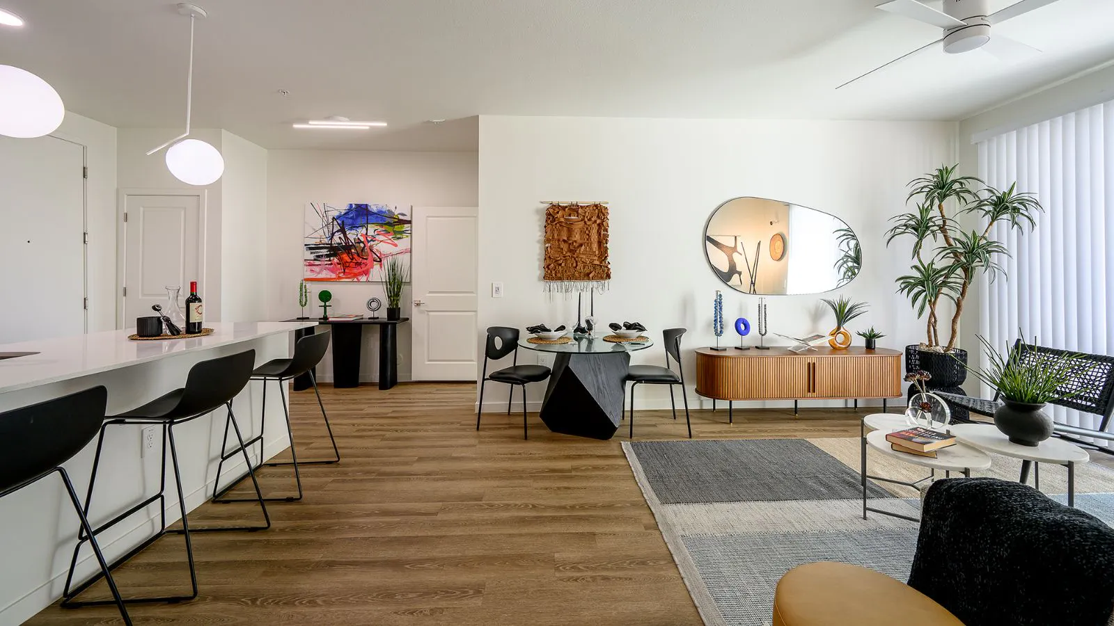 Furnished apartment living area shown — representative home at The M at Shadow Mountain.